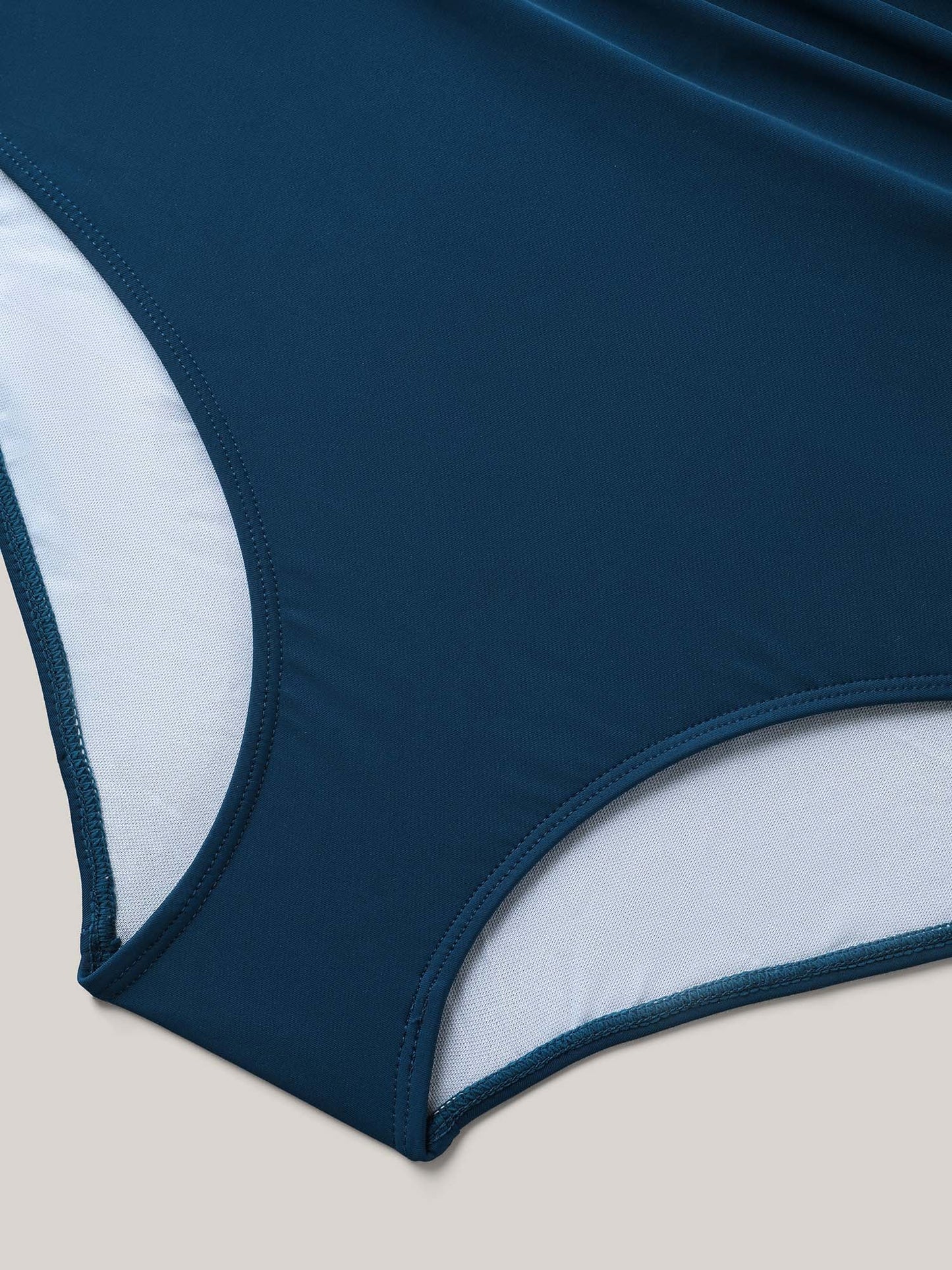 AquaWrap™ – Solid One-Piece Swimsuit with Wrap Neck and Belt