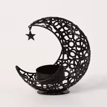 Moderner schwarzer Kerzenhalter mit Mond und Sternen in Gold