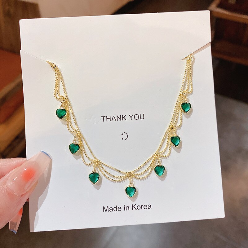 CrystalMesh™ | Green crystal pendant made of braided metal mesh 